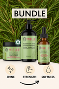 Mielie hair care product bundle with shampoo, mask, and oil on a green leafy background.